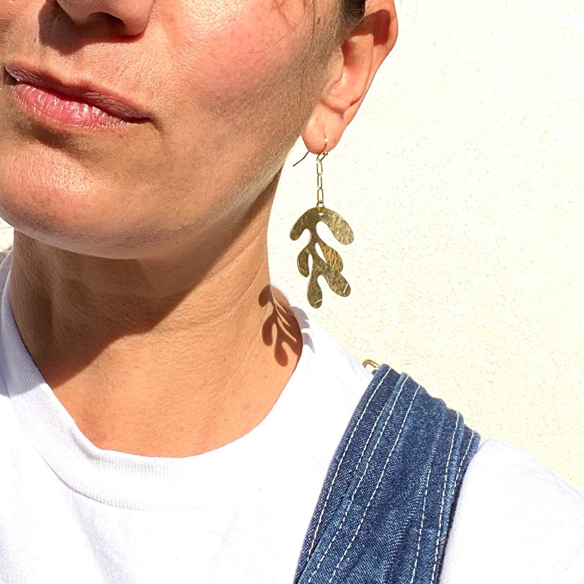 Large modern white gold hand hammered leaf earring